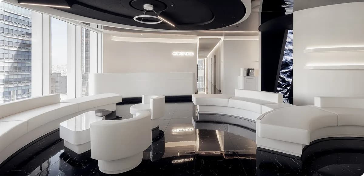 Waiting lounge at Benjamin Clinic with curved white seating